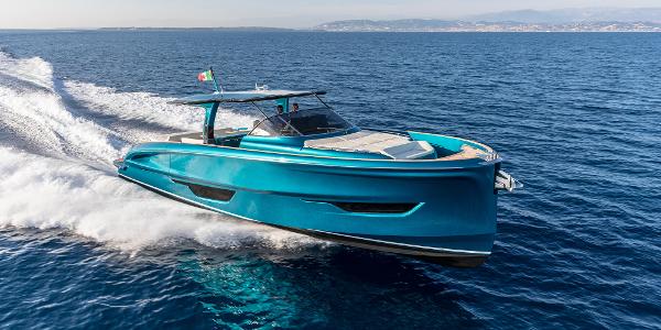 Solaris Power 52 open 2024 Solaris Power 52 Open yacht cruising on open sea, showcasing sleek design and vibrant blue color.