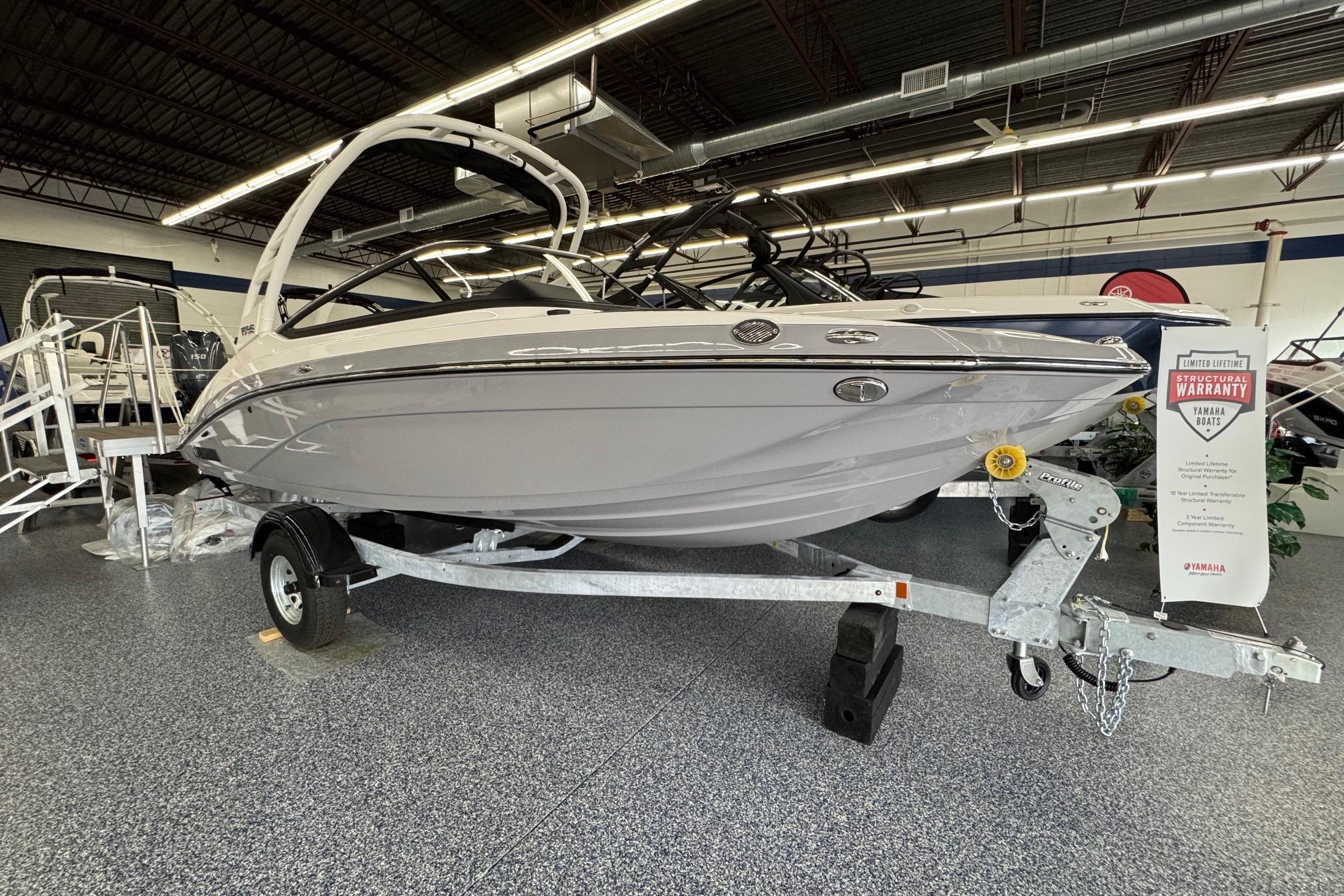 Yamaha Boats 195S 2026 Yamaha Boats 195S displayed indoors on a trailer, featuring a sleek design.