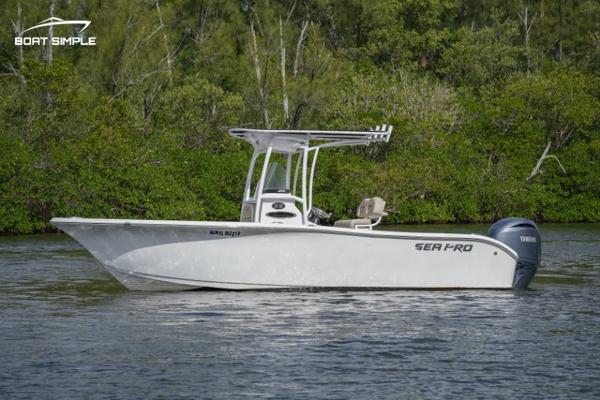 Sea Pro 219 Deep V CC 2023 Sea Pro 219 Deep V CC boat on water with lush green background.