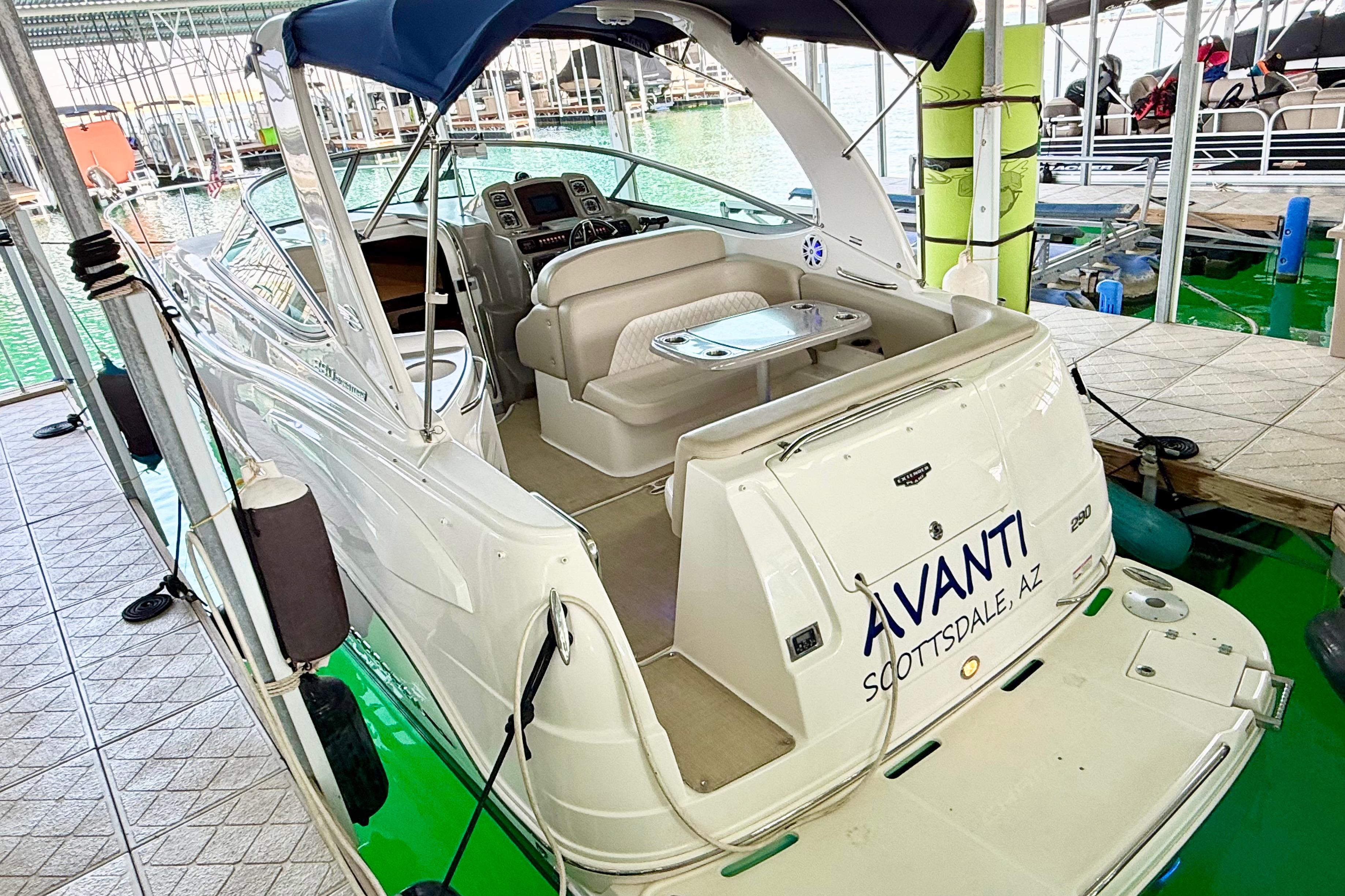 Chaparral 290 Signature 2016 Chaparral 290 Signature boat docked, featuring spacious seating and elegant design.