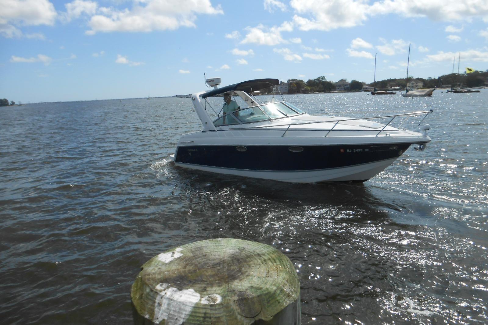 Formula 27 Performance Cruiser 2004 Formula 27 Performance Cruiser on a sunny day, navigating calm waters.