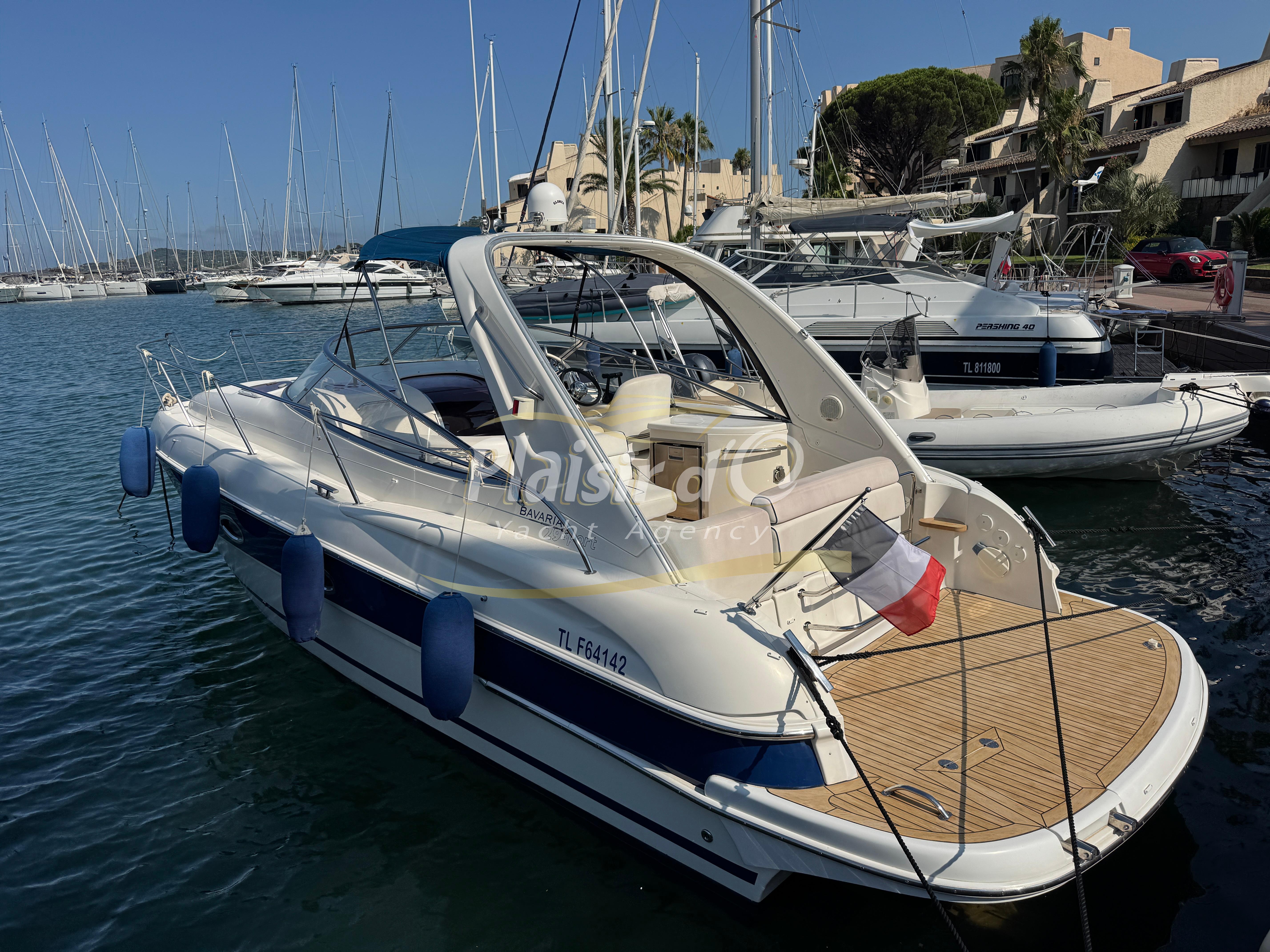 Bavaria 29 Sport 2005 Bavaria 29 Sport yacht docked in a marina, featuring sleek design and spacious deck.
