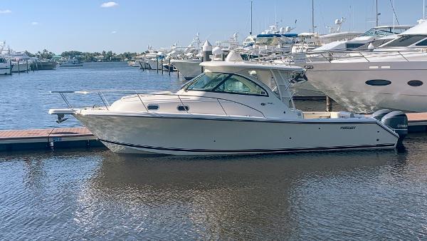 Pursuit OS 345 Offshore 2012 Pursuit OS 345 Offshore boat docked in a marina.