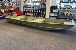 Tracker Grizzly 14 Jon 2026 Tracker Grizzly 14 Jon boat displayed in a store with marine supplies.