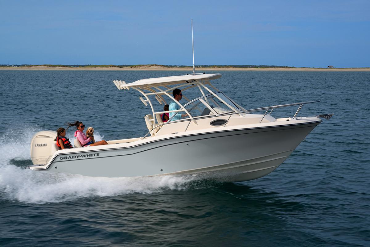 Grady-White 218 2026 Grady-White 218 boat cruising on open water with passengers onboard.