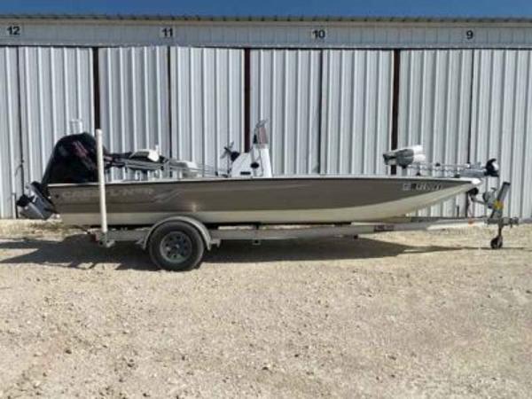 Crestliner 2000 Bay 2019 Crestliner 2000 Bay boat on trailer, parked outside storage units.