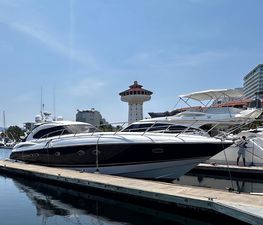 Sunseeker Predator 56 Sunseeker Predator 56 yacht docked at marina, clear sky, 2000 model.