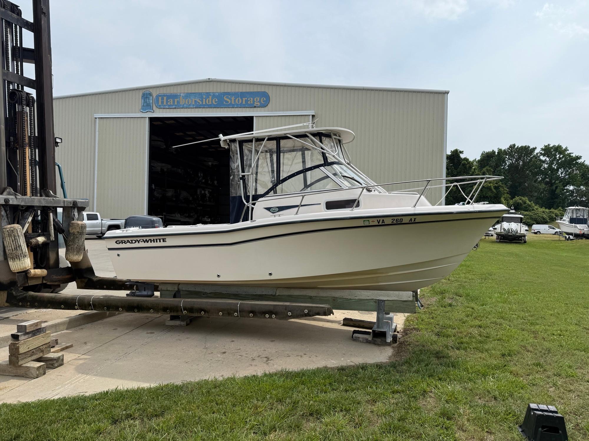 Grady-White 208 Adventure 2001 Grady-White 208 Adventure boat on trailer near storage facility.