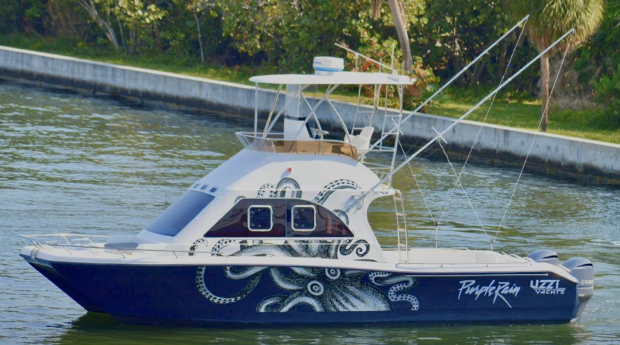 Two Oceans 36 Magnum Two Oceans 36 Magnum yacht with octopus design, cruising on a calm waterway.