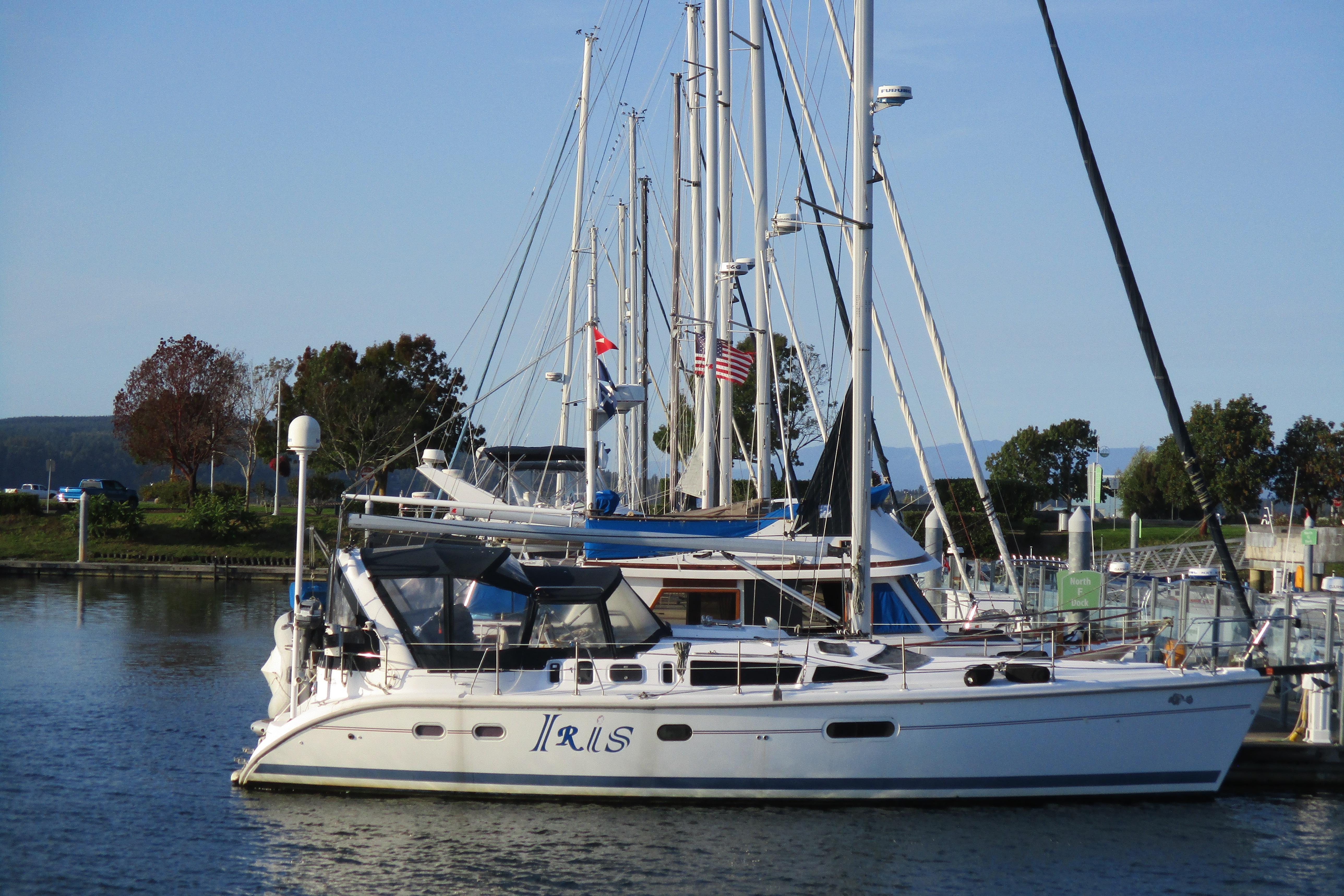 Hunter 410 Sailboats docked at a marina, featuring a 1999 Hunter 410 model.