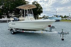 Release 180 CC 2016 Release 180 CC boat on trailer, parked outdoors under cloudy sky.