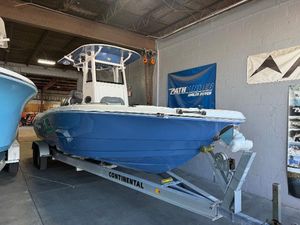 NauticStar 251 Hybrid 2025 NauticStar 251 Hybrid boat in a garage on a Continental trailer.