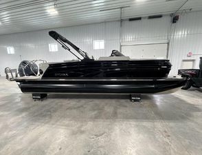 Sylvan G3 CLZ DC 2024 Sylvan G3 CLZ DC pontoon boat in a spacious indoor showroom.