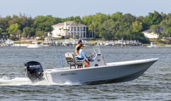 Sea Pro 210 Bay 2024 Sea Pro 210 Bay boat cruising on a lake with a Suzuki outboard motor.