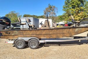 G3 Bay 21 GX Tunnel 2026 G3 Bay 21 GX Tunnel boat on trailer, camo design, outdoor setting.