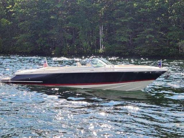Chris-Craft Launch 27 2025 Chris-Craft Launch 27 boat cruising on a scenic lake.