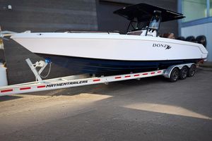 Donzi 35 ZF Cuddy 2006 Donzi 35 ZF Cuddy boat on Mayhem Trailers, parked outdoors.