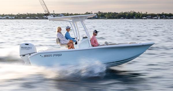 Sea Pro 202 Center Console 2024 Sea Pro 202 Center Console boat cruising on water with three passengers.