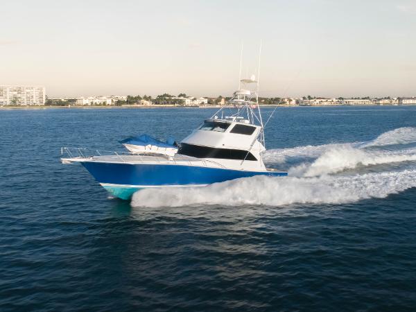 Viking 65 Convertible Enclosed Bridge 2003 Viking 65 Convertible Enclosed Bridge yacht cruising on open water.