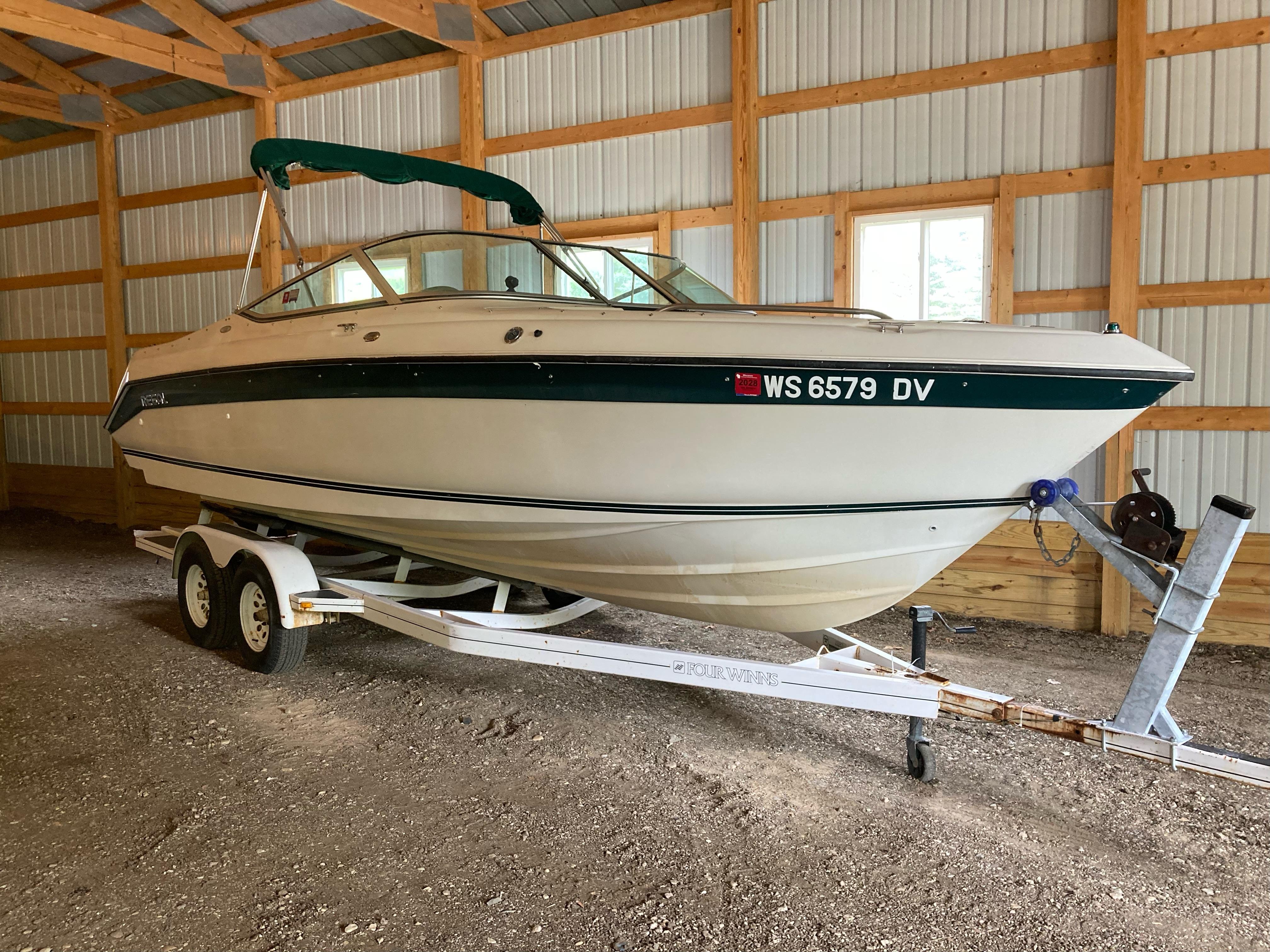 Regal 7.0 SE 1996 Regal 7.0 SE boat on trailer in a wooden garage.