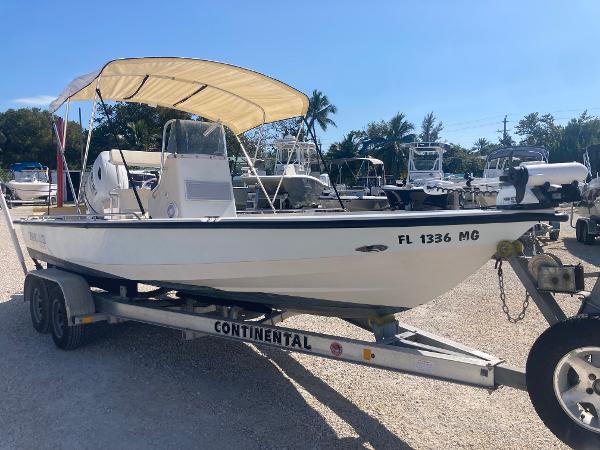 Pathfinder 2200-v 2001 Pathfinder 2200v boat on trailer with canopy, parked outdoors.