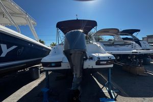 Hurricane SunDeck 2690 OB 2019 Hurricane SunDeck 2690 OB boat on display with outboard motor.