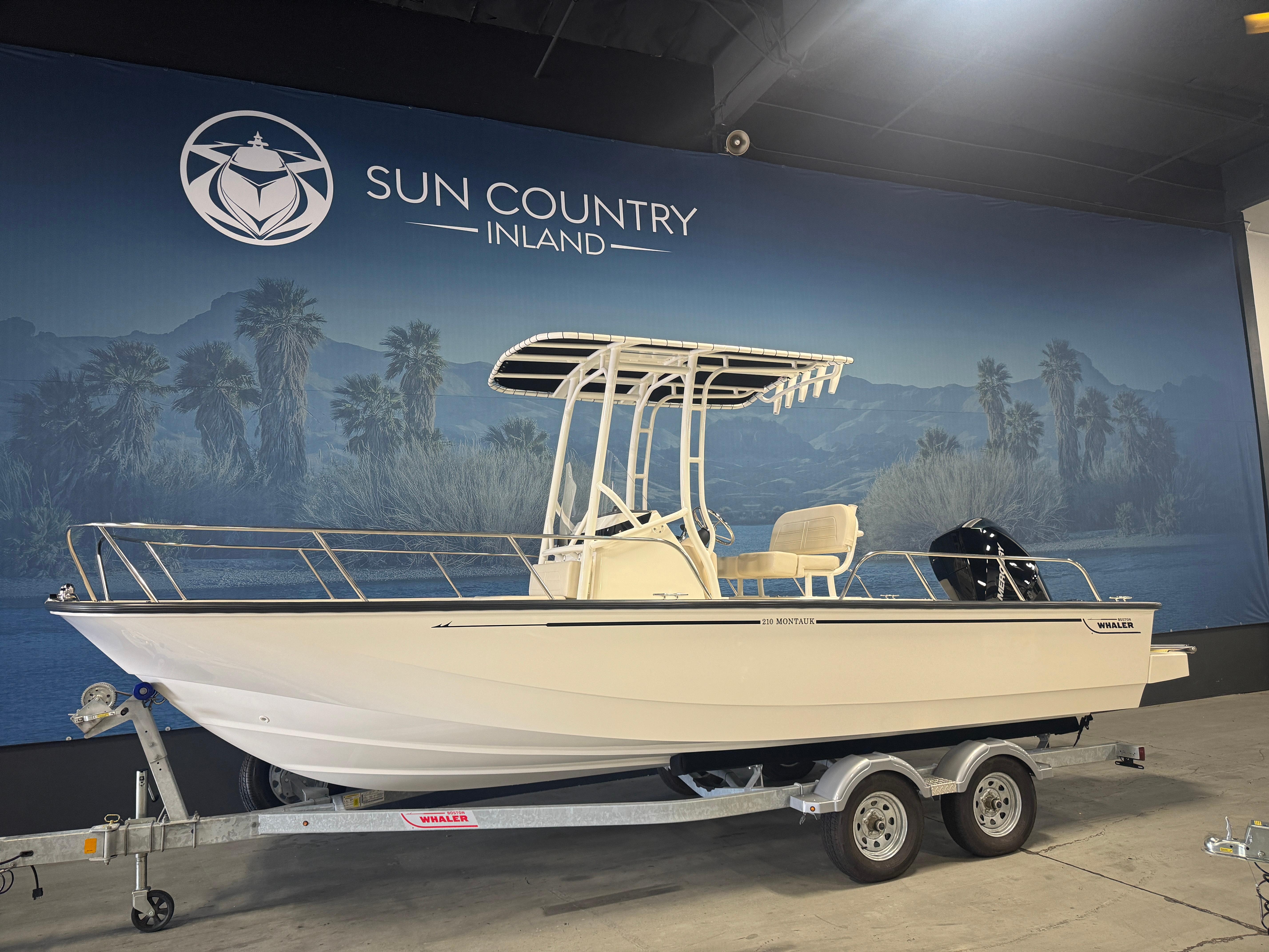 Boston Whaler 210 Montauk 2024 Boston Whaler 210 Montauk boat on trailer at Sun Country Inland showroom.