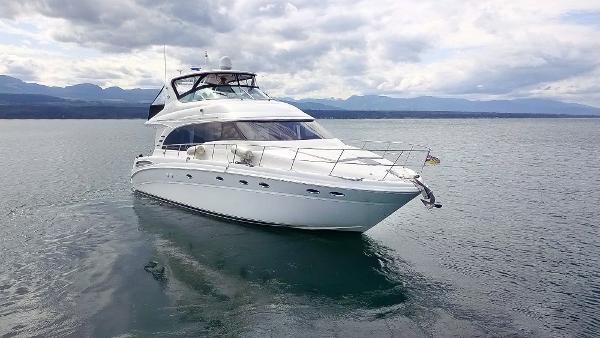 Sea Ray 540 Cockpit Motor Yacht 2002 Sea Ray 540 Cockpit Motor Yacht cruising on calm waters under cloudy skies.