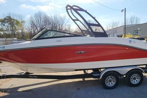 Sea Ray SPX 210 Outboard 2021 Sea Ray SPX 210 Outboard boat on trailer, red and white design, parked outdoors.