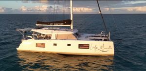 Nautitech 46 Open 2020 Nautitech 46 Open catamaran sailing on calm ocean waters at sunset.