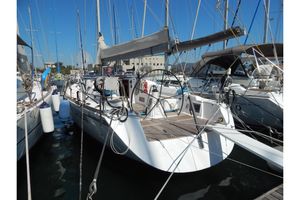 Salona 45 2006 AD BOATS LTD Salona 45 sailboat docked in a marina under clear blue skies.
