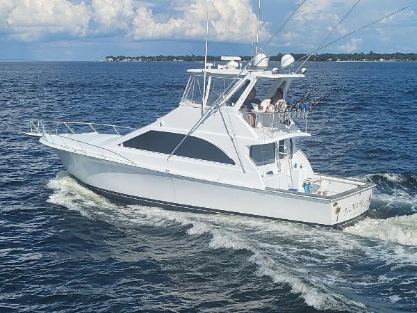 Ocean Yachts 48 Super Sport 1999 Ocean Yachts 48 Super Sport cruising on open water under a cloudy sky.