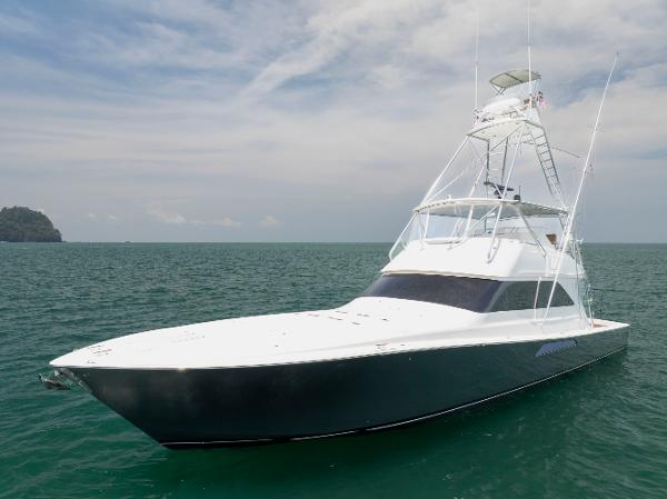 Viking 61 Convertible 2003 Viking 61 Convertible yacht on open water under a partly cloudy sky.