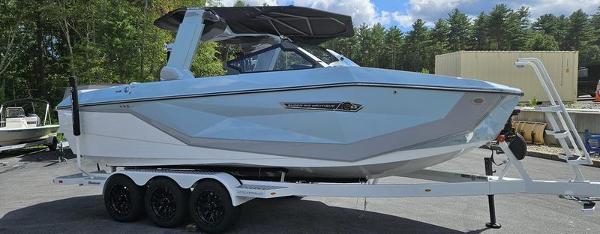 Nautique Super Air Nautique G23 2025 Nautique Super Air Nautique G23 boat on trailer, parked outdoors.