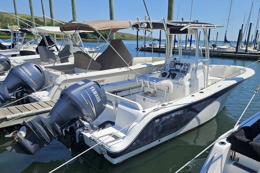 Sea Fox 226CC 2012 Sea Fox 226CC boat docked, featuring Yamaha outboard motor, in a marina setting.