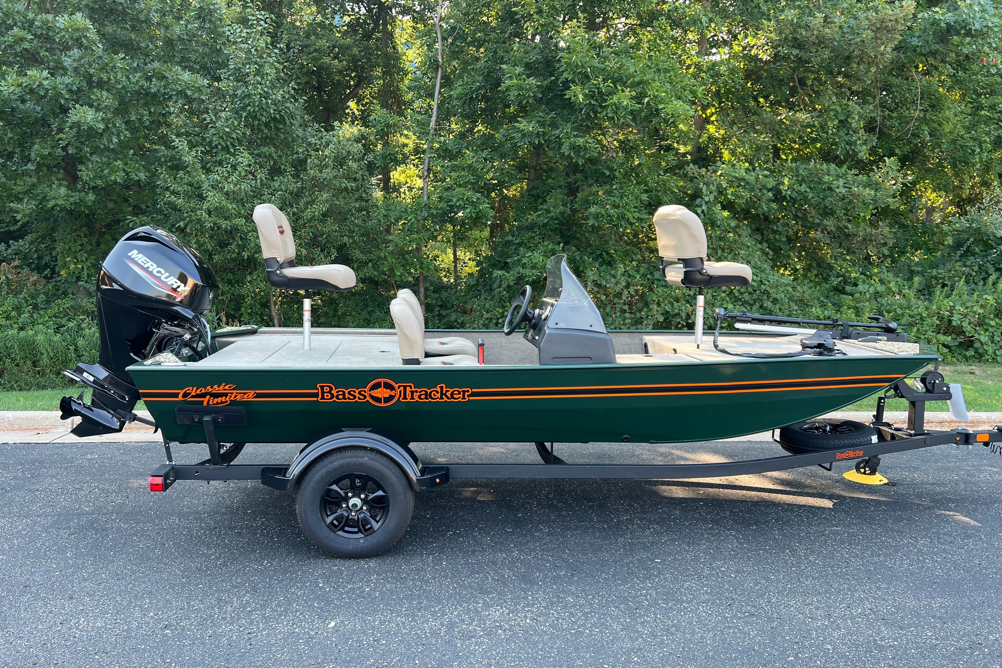 Tracker Bass Tracker Classic Limited 2026 Tracker Bass Tracker Classic Limited boat on trailer, parked on road with trees in background.