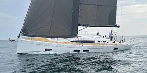 J-Composites J40 2024 J-Composites J40 sailboat cruising on open water with sleek design and dark sails.