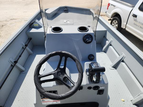 SeaArk 1872 MVT 2025 SeaArk 1872 MVT boat interior with steering wheel and control panel.