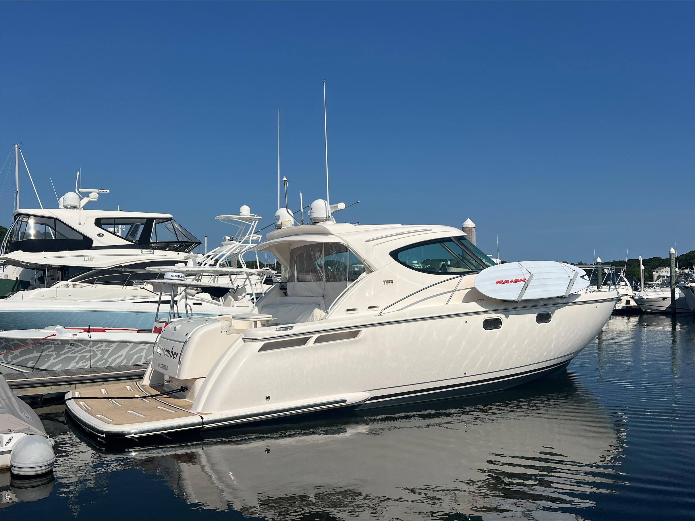 Tiara Yachts 4500 Sovran 2013 Tiara Yachts 4500 Sovran docked in a marina under clear blue skies.