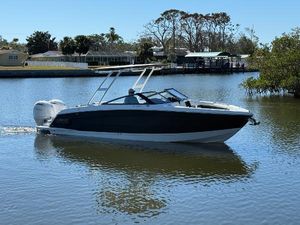 Cobalt R8 Outboard 2025 Cobalt R8 Outboard boat cruising on a calm river.