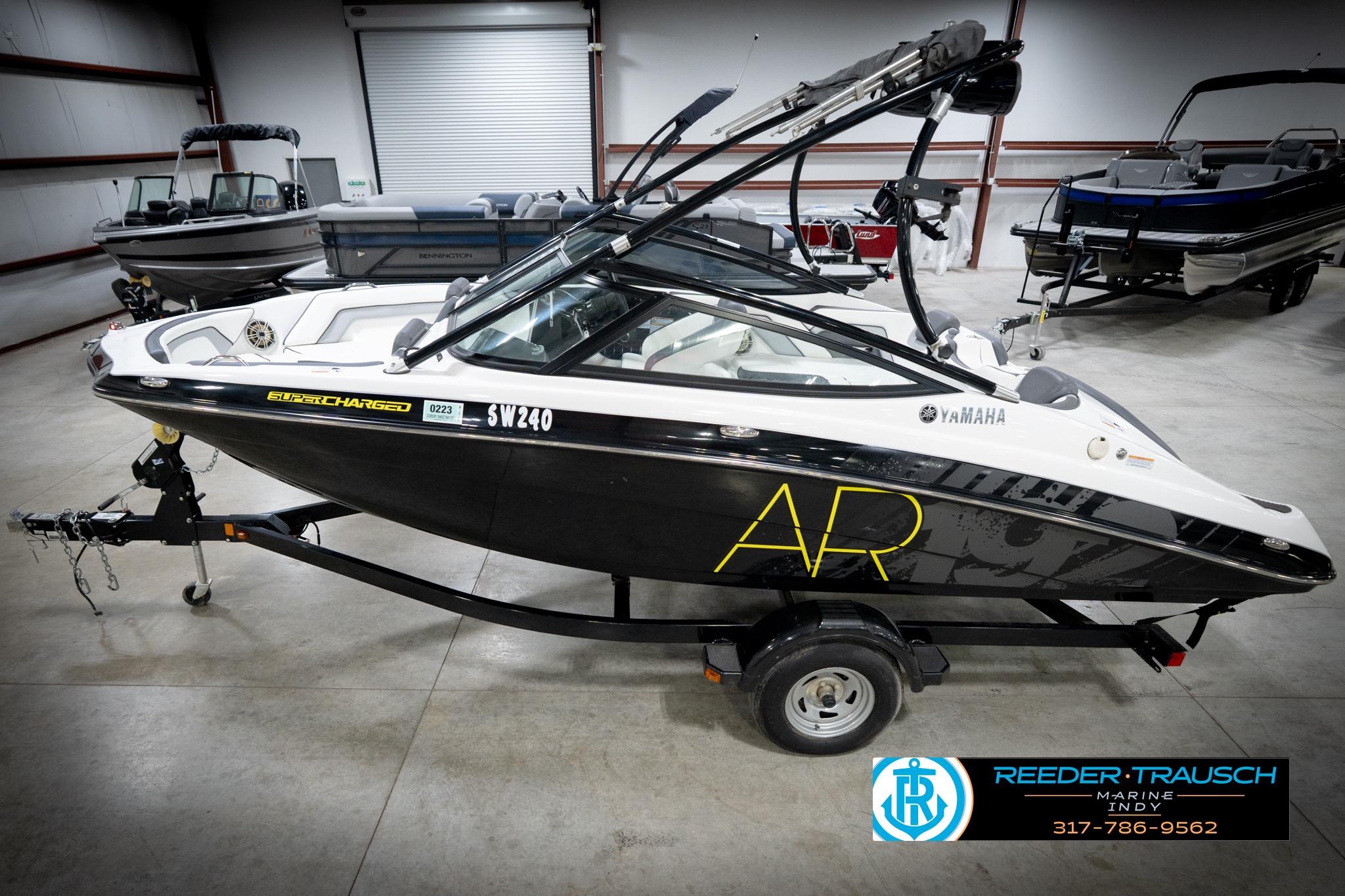 Yamaha Boats AR192 2015 Yamaha AR192 boat in showroom, black and white design, on trailer.