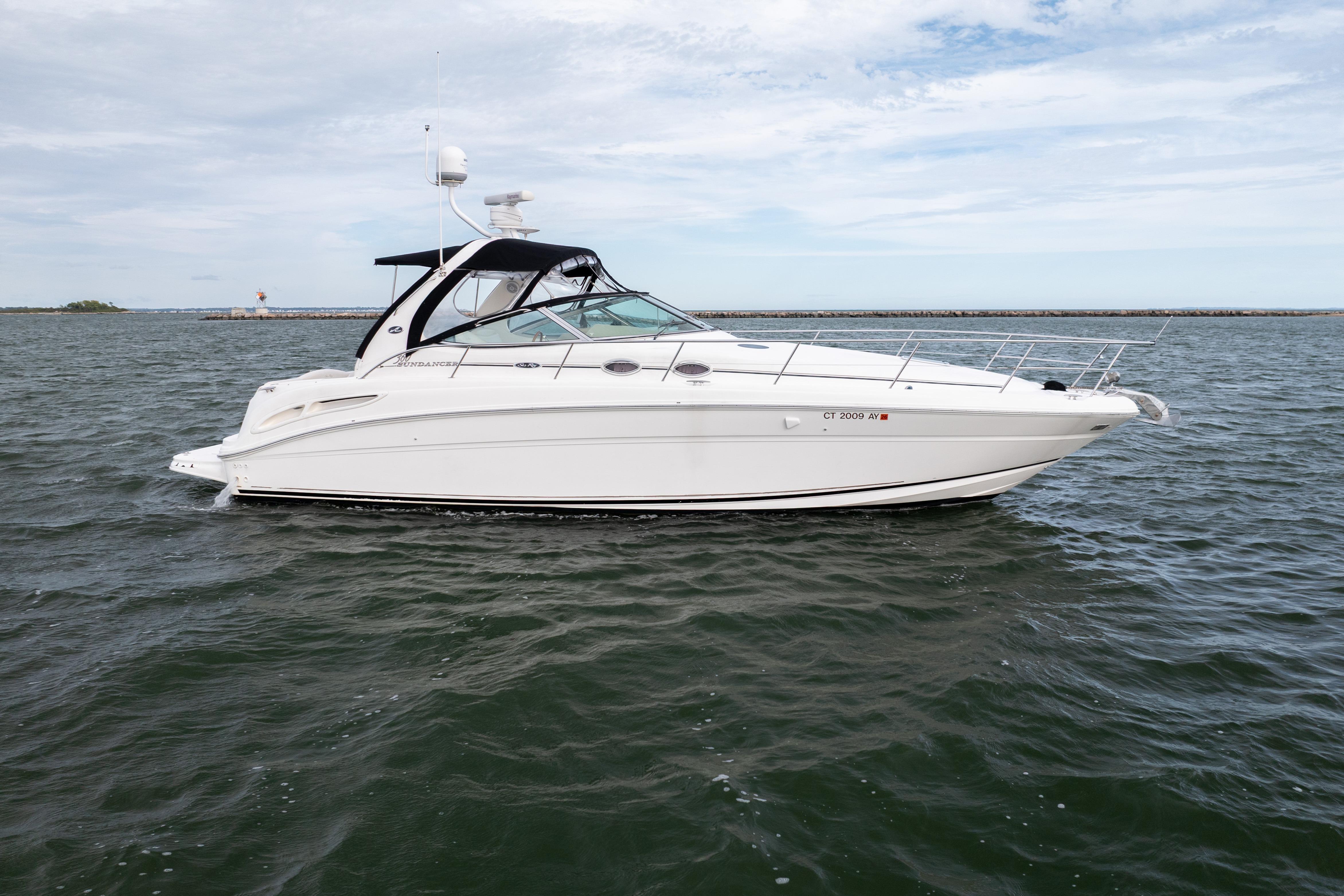 Sea Ray 360 Sundancer 2003 Sea Ray 360 Sundancer yacht cruising on open water under a cloudy sky.