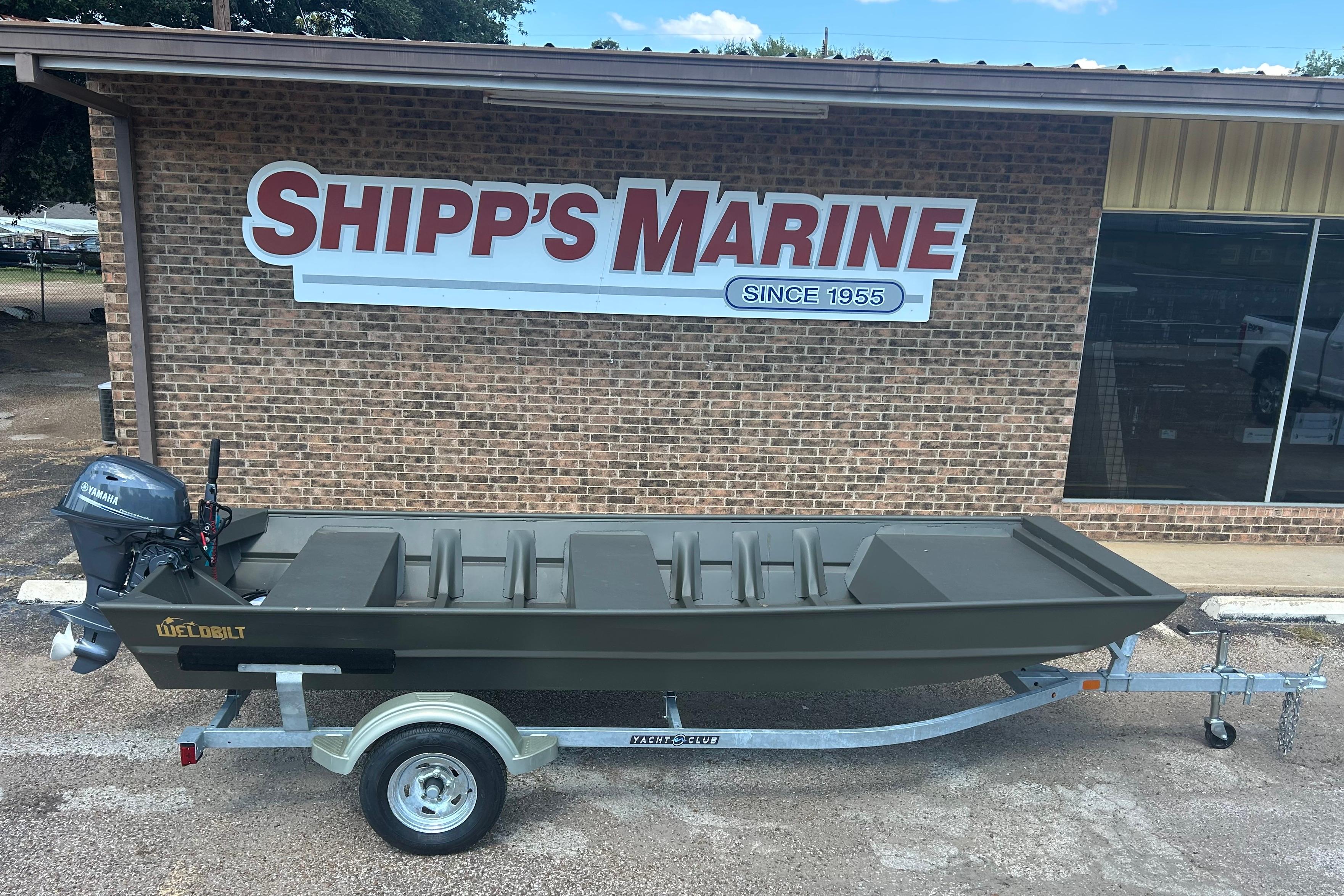 WeldBilt 1548 2025 WeldBilt 1548 boat on trailer outside Shipp's Marine store.