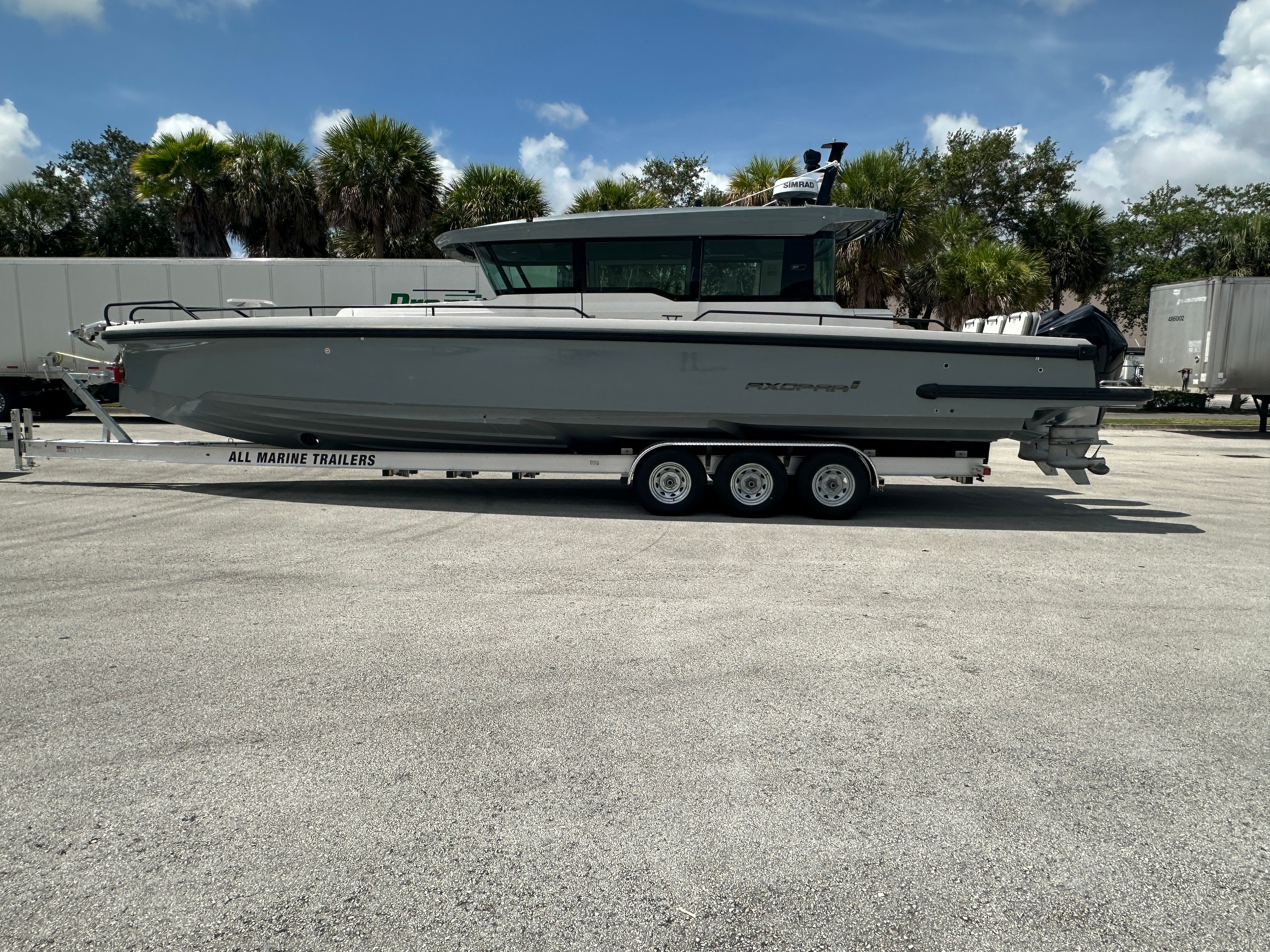Axopar 37 XC CROSS CABIN 2020 Axopar 37 XC CROSS CABIN boat on trailer, parked outdoors.