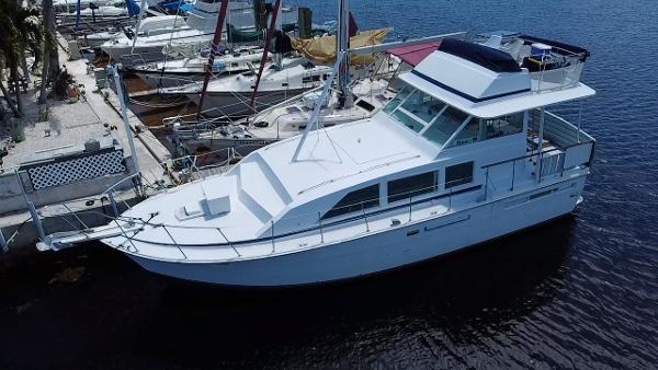 Bertram 42 Motor Yacht 1974 Bertram 42 Motor Yacht docked at marina, surrounded by other boats.
