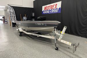 Lund 1600 Angler 1993 Lund 1600 Angler boat on trailer at Westre's Marine & Sport showroom.