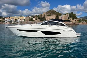 Sessa Marine C38 2022 Sessa Marine C38 yacht on scenic coastal waters with historic architecture backdrop.