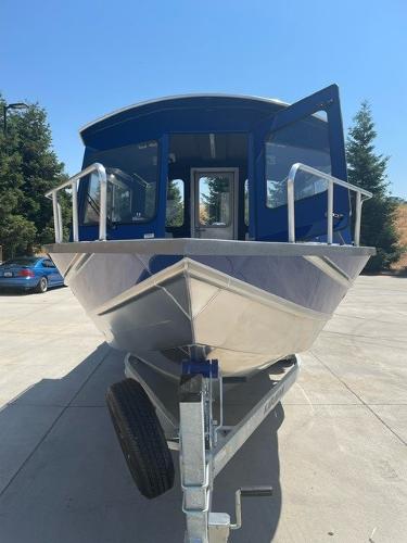 Spartan 240 Maximus Pro 2025 Spartan 240 Maximus Pro boat on trailer, front view, outdoors.