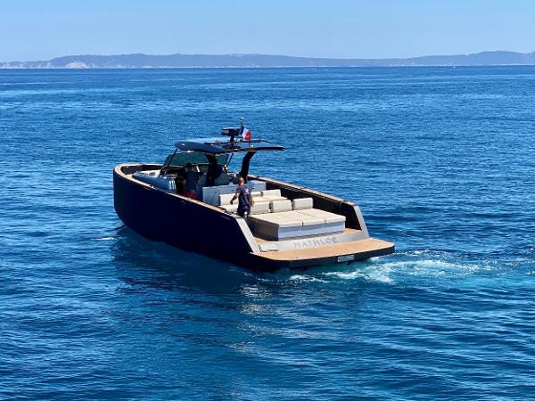 Pardo Yachts 43 2020 Pardo Yachts 43 cruising on open blue sea with scenic coastline in background.