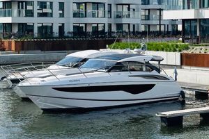 Princess V40 2024 Princess V40 yacht docked in a modern marina setting.